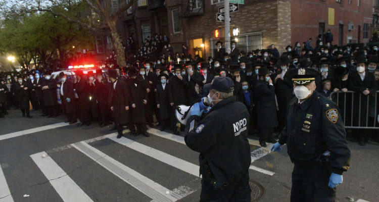 ‘We live here but we’re not Americans’: 1000s attend hasidic funeral in NY, no masks