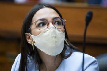 Rep. Alexandria Ocasio-Cortez, D-N.Y., listens during a House Oversight and Reform Committee hearing on Monday, Aug. 24, 2020, in Washington. (AP Photo/Pool/Tom Williams)