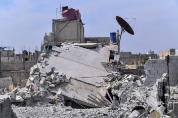 This photo released by the Syrian official news agency SANA, shows the rubble of a house that according to the Syrian authorities was attacked by an Israeli airstrike, in the Damascus suburbs of Hajira, Syria, Monday, April 27, 2020. (AP Photo/SANA)