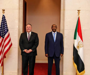 U.S. Secretary of State Mike Pompeo stands with Sudanese Gen. Abdel-Fattah Burhan, the head of the ruling sovereign council, in Khartoum, Sudan, Tuesday, Aug. 25, 2020. (AP Photo/Sudanese Cabinet)