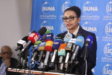 Sudanese Finance Minister Heba Mohamed Ali speaks during a press conference in Khartoum, Sudan, Tuesday Oct. 20, 2020. President Donald Trump on Monday said Sudan will be removed from the U.S. list of state sponsors of terrorism if it follows through on its pledge to pay $335 million to American terror victims and their families. (AP Photo/Marwan Ali)