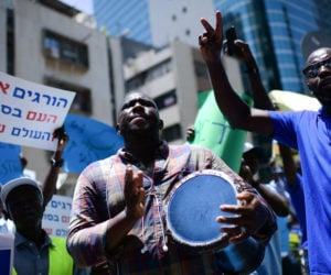 Sudanese demonstrate in support of their people in Sudan, outside the European Union Embassy in Tel Aviv, June 25, 2019. (Flash90/Tomer Neuberg)