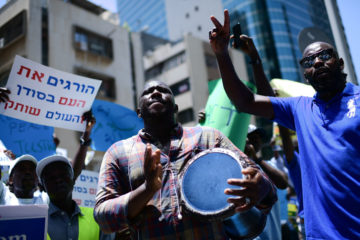 Sudanese demonstrate in support of their people in Sudan, outside the European Union Embassy in Tel Aviv, June 25, 2019. (Flash90/Tomer Neuberg)
