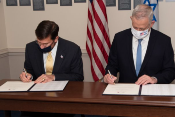 Israeli Defense Minister Benny Gantz (R) and US Secretary of Defense Mark Esper (L) sign a joint agreement on the US commitment to Israel's qualitative military edge in the region. (Twitter/Mark Esper/Screenshot)