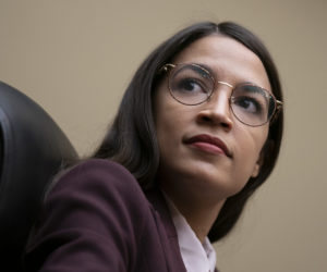 Rep. Alexandria Ocasio-Cortez, D-N.Y., attends a House Oversight Committee hearing on high prescription drugs prices in Washington, Friday, July 26, 2019. (AP Photo/J. Scott Applewhite)