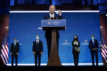 President-elect Joe Biden removes his face mask as he arrives to introduce his nominees and appointees to key national security on Tuesday, Nov. 24, 2020, in Wilmington, Del. (AP Photo/Carolyn Kaster)