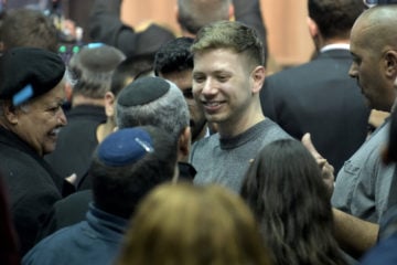 Yair Netanyahu, the son Israeli Prime Minister Benjamin Netanyahu, with supporters after the release of exit polls results of the Israeli general election, at the Likud party's headquarters in Tel Aviv, on March 3'rd, 2020. (Flash90/Gili Yaari)