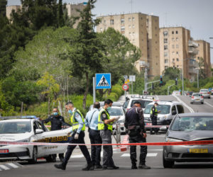 Police at the scene where a car hit a woman and a 6-years-old child in Jerusalem on May 11, 2020. (Flash90/Olivier Fitoussi)