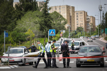 Police at the scene where a car hit a woman and a 6-years-old child in Jerusalem on May 11, 2020. (Flash90/Olivier Fitoussi)