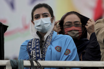 Asifa Bhutto Zardari, left, a leader of the Pakistan Democratic Movement, an alliance of opposition parties, attends an anti-government rally, in Multan, Pakistan, Monday, Nov. 30, 2020. (AP Photo/Asim Tanveer)