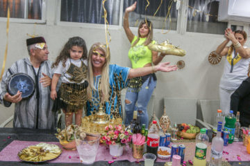 Members of the Ivgi family celebrate the Jewish Moroccan celebration of Mimuna, in the southern Israeli city of Ashkelon, April 15, 2020. (Flash90/Edi Israel)