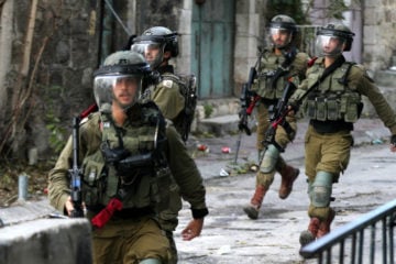 Palestinian youth clash with Israeli security forces during a protest in Hebron, November 27, 2020. (Flash90/Wisam Hashlamoun)