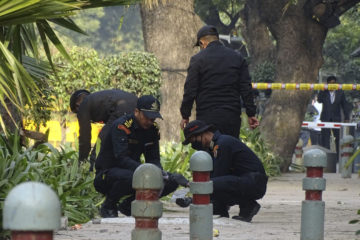 National Security Guard soldiers inspect the site of a blast near the Israeli Embassy in New Delhi, India, Saturday, Jan. 30, 2021. (AP Photo/Dinesh Joshi)