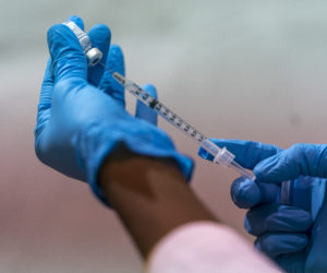 A syringe with the Pfizer-BioNTech COVID-19 Vaccine at a pop-up COVID-19 vaccination in the Bronx, NY, on Sunday, Jan. 31, 2021. (AP Photo/Mary Altaffer)