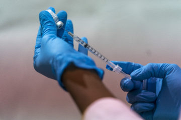A syringe with the Pfizer-BioNTech COVID-19 Vaccine at a pop-up COVID-19 vaccination in the Bronx, NY, on Sunday, Jan. 31, 2021. (AP Photo/Mary Altaffer)