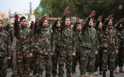 Hezbollah terrorists salute