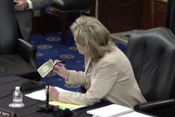 U.S. Sen. Cindy Hyde-Smith with dollar bill