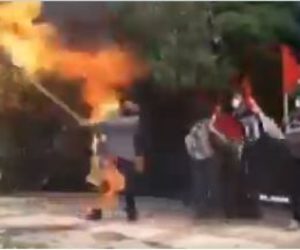 Iranian burns Israeli flag
