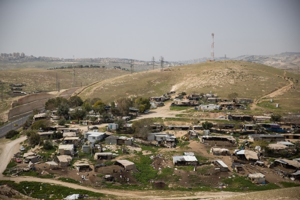 Lapid asks for new delay in demolishing illegal Arab town near Jerusalem
