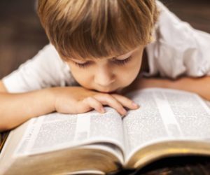 Child reading bible