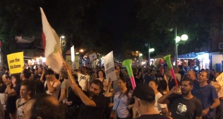 Israelis march in Tel Aviv in protest of COVID restrictions