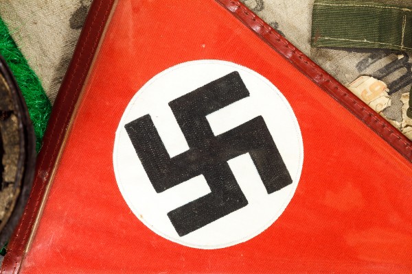 ‘Pure evil’: Police seize Nazi flag flown near synagogue on Shabbat