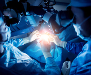 A,Team,Of,Surgeons,Performing,Brain,Surgery,To,Remove,A