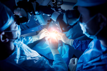 A,Team,Of,Surgeons,Performing,Brain,Surgery,To,Remove,A