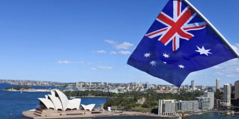 The,National,Flag,Of,Australia,Flies,Above,Sydney,Harbor,And