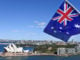 The,National,Flag,Of,Australia,Flies,Above,Sydney,Harbor,And