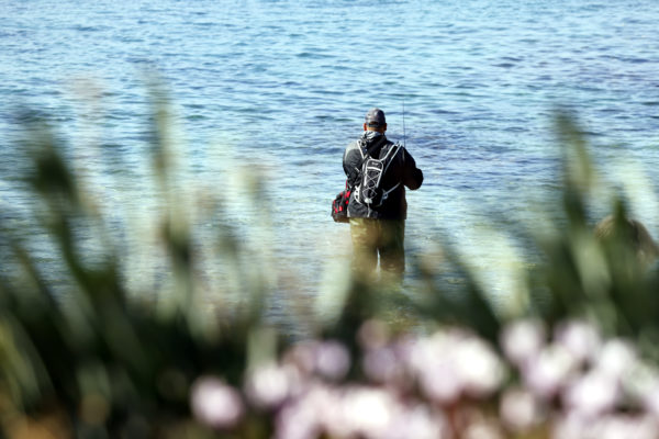 A man fishing on the Hadera Beach