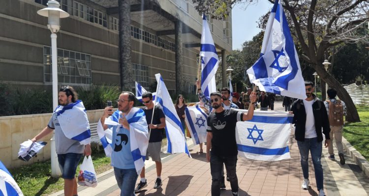 Israeli university overturns prohibition on hanging Israeli flags following backlash