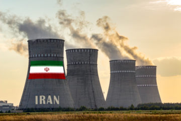 Nuclear plant chimneys displaying flag of Iran