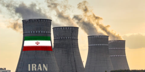 Nuclear plant chimneys displaying flag of Iran