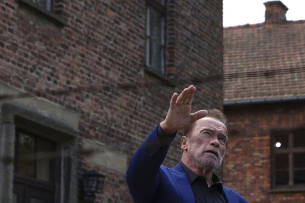 Arnold Schwarzenegger makes first visits to Auschwitz in message against hatred