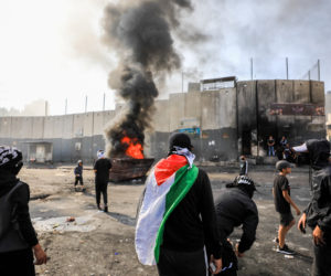 Arab rioters clash with Israeli security personnel in Shuafat