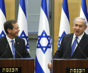 Newly elected Israeli president Isaac Herzog with Israeli Prime Minister Benjamin Netanyahu in the Israeli pariament on the day of the presidential elections, in Jerusalem,