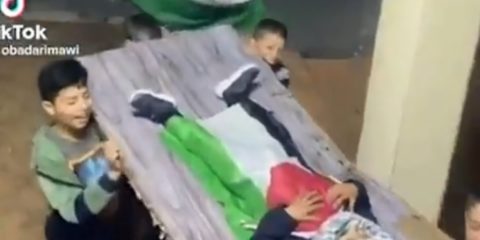 Palestinian children act out a martyr's funeral. Screengrab tiktok