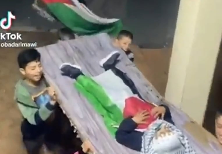 Palestinian children act out a martyr's funeral. Screengrab tiktok