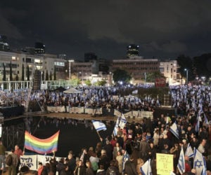 Israelis protest against the government's plans to overhaul the country's legal system, in Tel Aviv, Israel, Saturday, Jan. 14, 2023. (AP Photo/Oded Balilty)