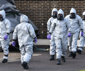 British army and police in hazmat suits