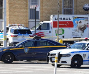 Police vehicles surround a truck that was stopped and the driver arrested, after he struck several pedestrians on Monday, Feb. 13, 2023, in New York. (AP Photo/John Minchillo)