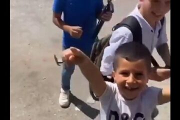 IDF soldiers play with Palestinian children