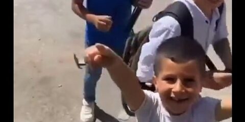 IDF soldiers play with Palestinian children