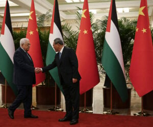 Chinese Premier Li Qiang, right, receives Palestinian President Mahmoud Abbas