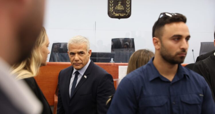 Lapid testifies in Netanyahu corruption trial; lawyer notes contradiction