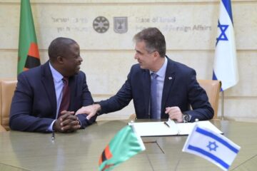 Israeli Foreign Minister Eli Cohen (right) meets with his Zambian counterpart Stanley Kakubo