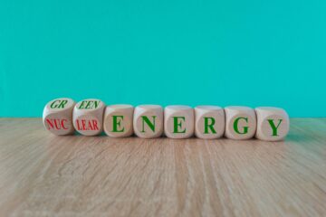 Nuclear,Or,Green,Energy,Symbol.,Turned,Wooden,Cubes,And,Changes