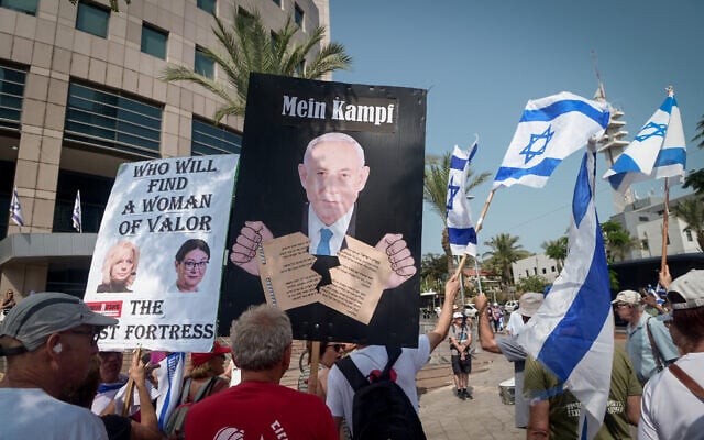 Anti-government protester sparks outrage with sign comparing Netanyahu to Hitler