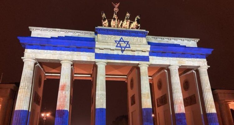 World landmarks lit in blue-and-white as U.S. sends munitions in practical support